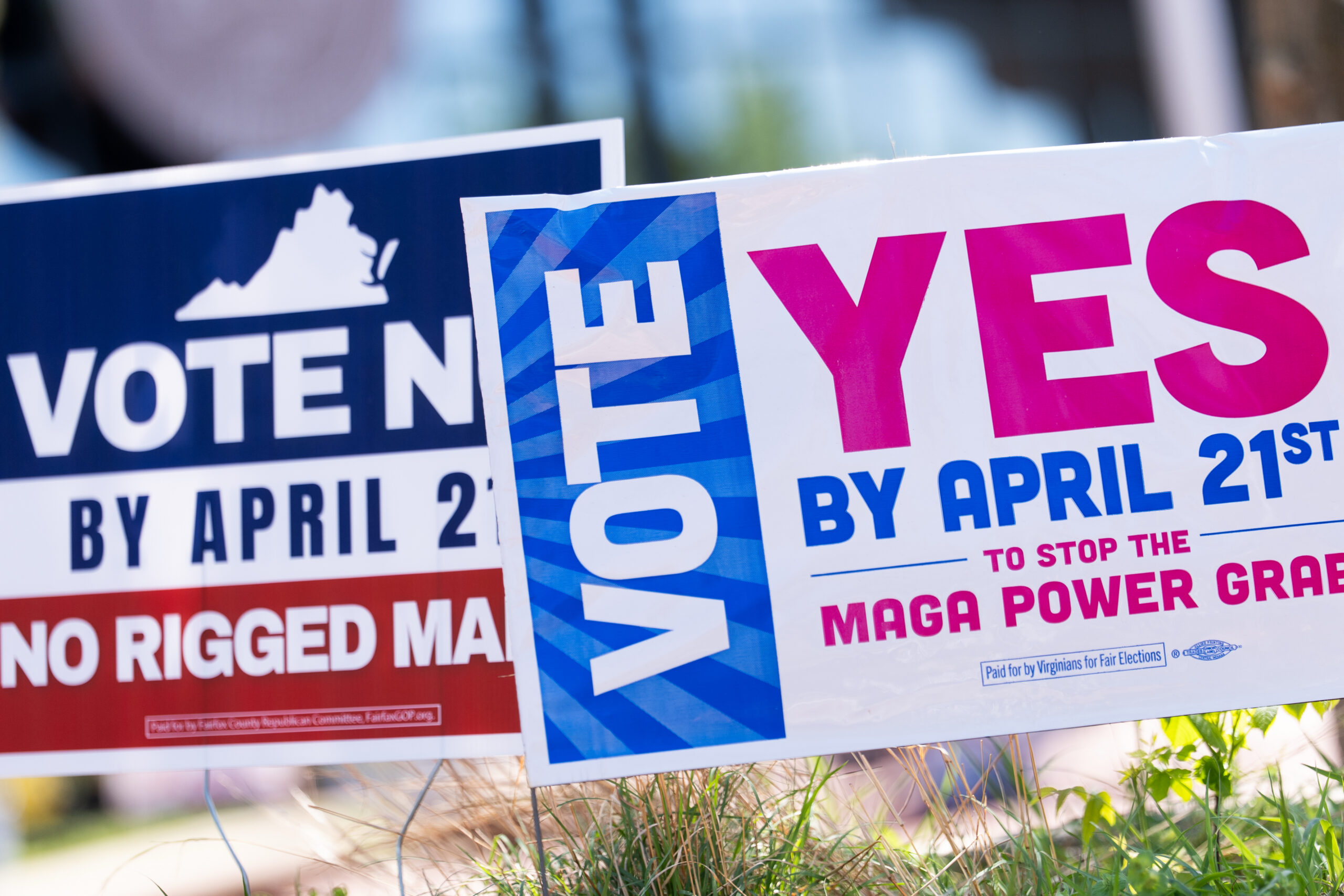 Signs are seen outside Fairfax Government Center during the Virginia redistricting referendum, Tuesday, April 21, 2026, in Fairfax, Va. (AP Photo/Julia Demaree Nikhinson)