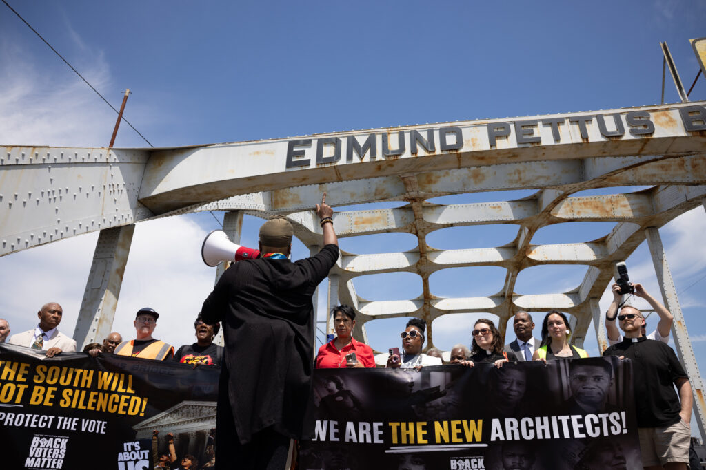 Participants from a coalition of voting rights groups march over the historic Edmund Pettus Bridge in Selma, Alabama, on May 16, 2026, following a prayer service at Tabernacle Baptist Church. This event is part of the All Roads Lead to the South: National Day of Action. The mobilization of activists and supporters continues at the Alabama State Capitol in Montgomery, Alabama, in response to recent redistricting actions in Southern states following the Supreme Court decision of Louisiana v. Callais. (Photo by Melissa Bender/NurPhoto via AP)